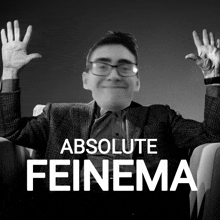 a black and white photo of a man with his hands in the air and the words absolute feinema below him