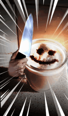 a person holding a knife over a cup of coffee