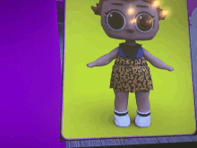 a doll with a leopard print skirt and white shoes is on a yellow background