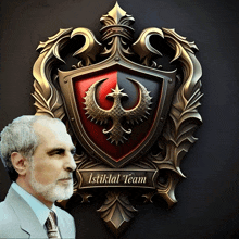 a man in a suit and tie stands in front of a shield that says istiklal team