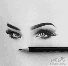 a black and white drawing of a woman 's eye with a pencil