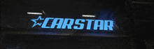 a blue sign that says carstar with a star on it