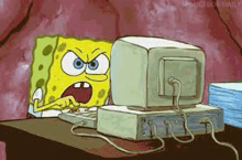 spongebob squarepants is sitting at a desk looking at a computer monitor .