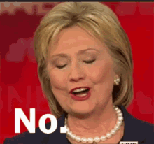 hillary clinton is wearing a pearl necklace and making a funny face while speaking on a red background .