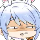 a close up of a cartoon character with blue hair and cat ears making a funny face .