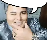 a man wearing a suit and a watch is smiling with a speech bubble above him .