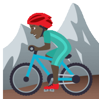 a person wearing a red helmet is riding a bike