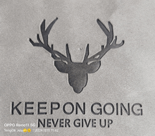 a picture of a deer head with antlers and the words keep on going never give up