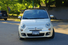 a white car with a license plate that says washington on it