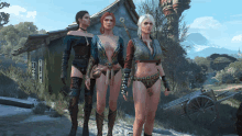 three women are standing in front of a building with a sword in their hand