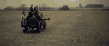 a black and white photo of a group of people in a jeep with the number 1 on the back