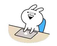 a cartoon of a rabbit sitting at a desk with a laptop .