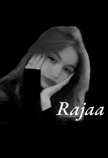 a black and white photo of a girl with the name rajaa