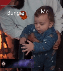 a baby is being held in someone 's arms with the words bungie me written on the bottom