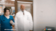 a blurry picture of a doctor and a nurse with nbc written on the bottom