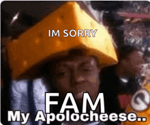 a man with a piece of cheese on his head says im sorry fam my apolo cheese