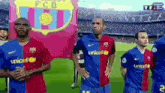 a group of soccer players are standing in front of a banner that says fcb