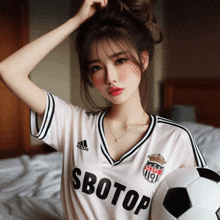 a woman is wearing a soccer jersey that says sbotop