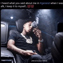 a man sitting in a car smoking a cigarette with the caption i heard what you said about me in #general