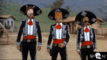 three men wearing mariachi costumes are standing next to each other