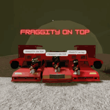 fraggity on top is displayed on a screen behind three red cars