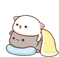 a cartoon cat is sitting on top of a gray cat on a pillow .