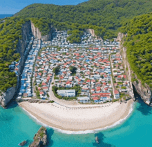 an aerial view of a residential area surrounded by water and mountains