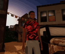 a man wearing headphones and a red camouflage shirt stands in front of a building