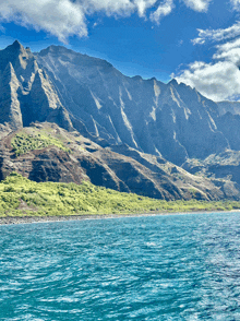 a large body of water is surrounded by mountains