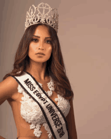 a woman wearing a miss egypt universe sash and a crown