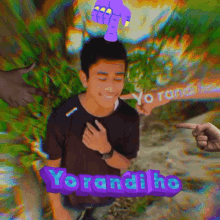 yorandiho is written on a purple sign next to a man in a black shirt