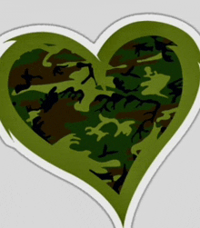 a heart shaped sticker with a camouflage pattern on it