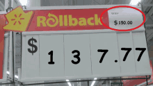 a sign in a store that says rollback for $ 1 3.77