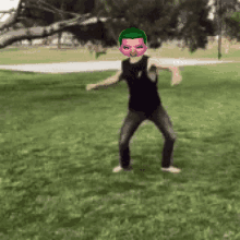 a man with a mask on his face is dancing in a park