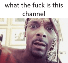 snoop dogg is making a funny face with the words what the fuck is this channel behind him