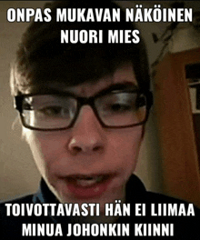 a young man wearing glasses is making a funny face with the caption onpas mukavan näköinen nuori mies