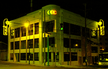 a building that says ccc on it is lit up at night