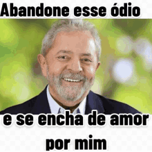 a man with a beard is smiling with the words abandone esse odio e se encha de amor por mim below him