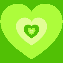 a green heart on a green background with a white heart in the middle .