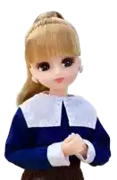 a doll wearing a blue shirt with a white collar and rhinestones on it