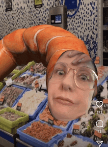 a woman with glasses and a shrimp on her head stands in front of a seafood display