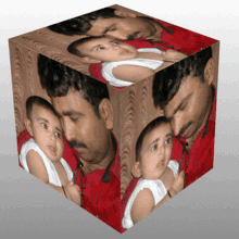 a cube with a picture of a man holding a baby in his arms