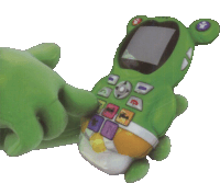 a green toy phone with a frog shaped face