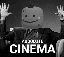 a black and white photo of a man with a smiley face on his head and the words absolute cinema