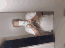 a man taking a picture of himself in a mirror with his phone