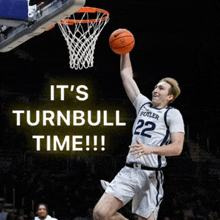 a basketball player with the number 22 on his jersey jumps to dunk the ball