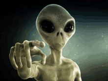 a gray alien is pointing at the camera with his finger