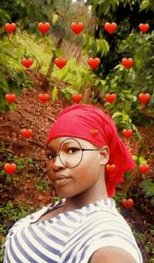 a woman wearing glasses and a red headband with hearts around her