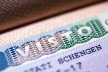 a close up of a schengen passport with the word visto on it