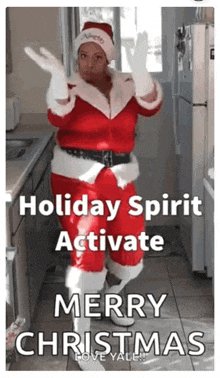 a woman in a santa suit is dancing in a kitchen with the words holiday spirit activate merry christmas above her